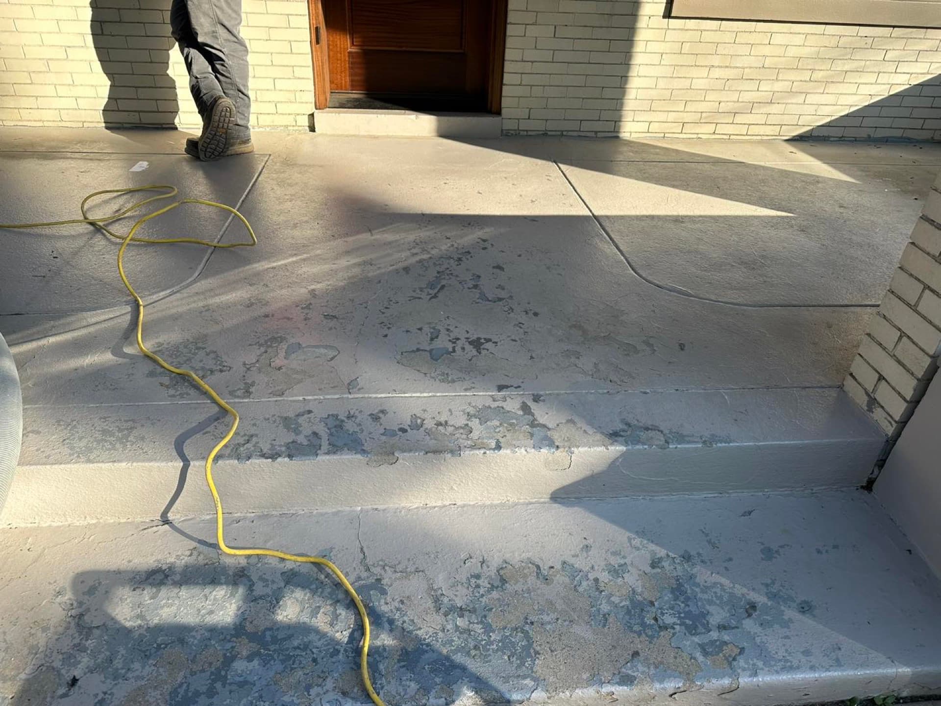 Before: Weathered front porch concrete