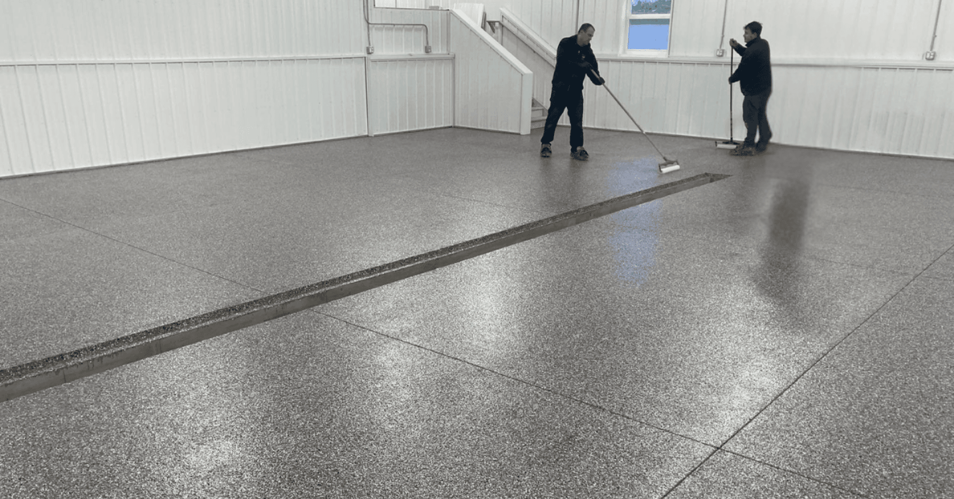 Commercial showroom floor coating install in progress