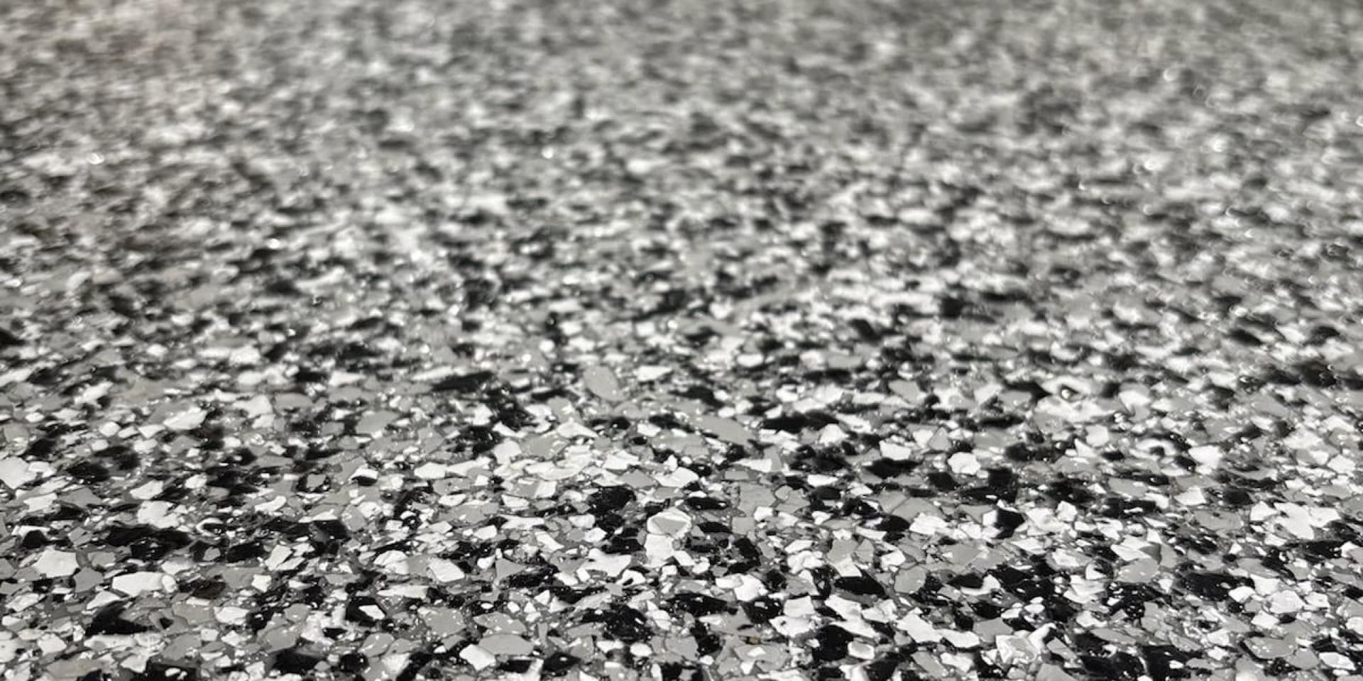 Close-up macro of polyaspartic flake texture