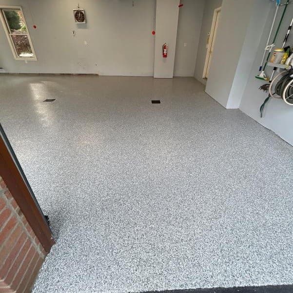 After: gray flake polyurea coated garage floor