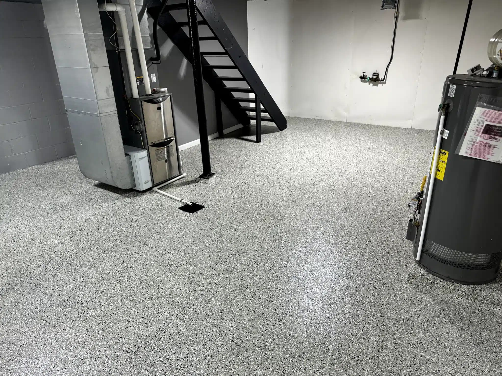 Basement utility room with seamless gray flake floor coating — Cuyahoga County, OH