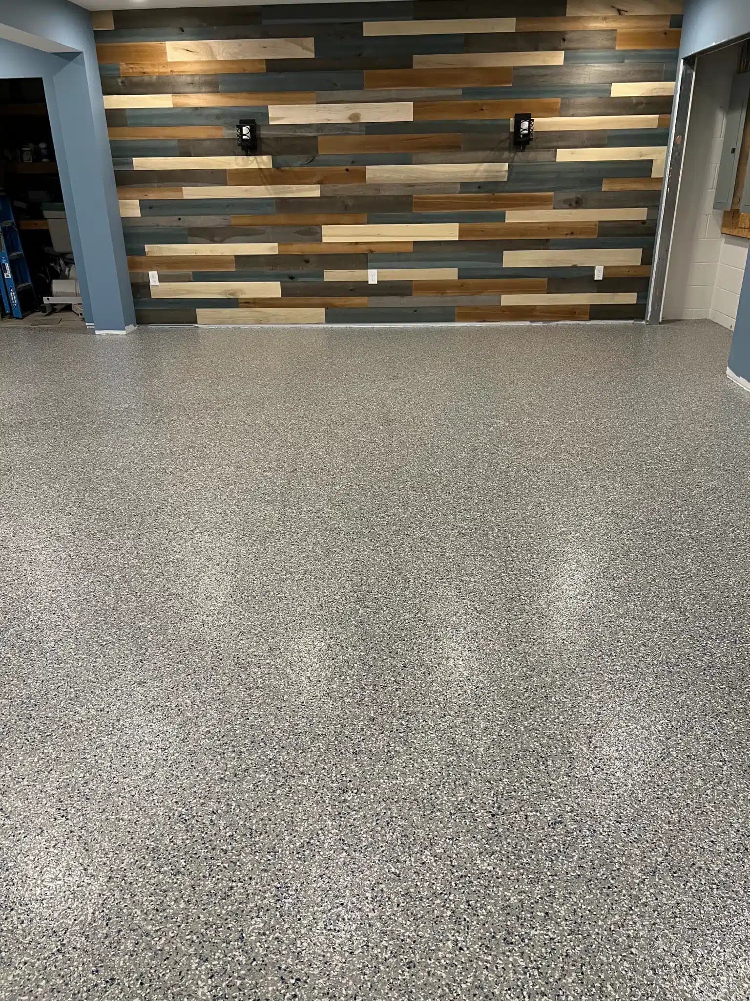 Basement floor coating with wood accent wall near Fairlawn, Summit County