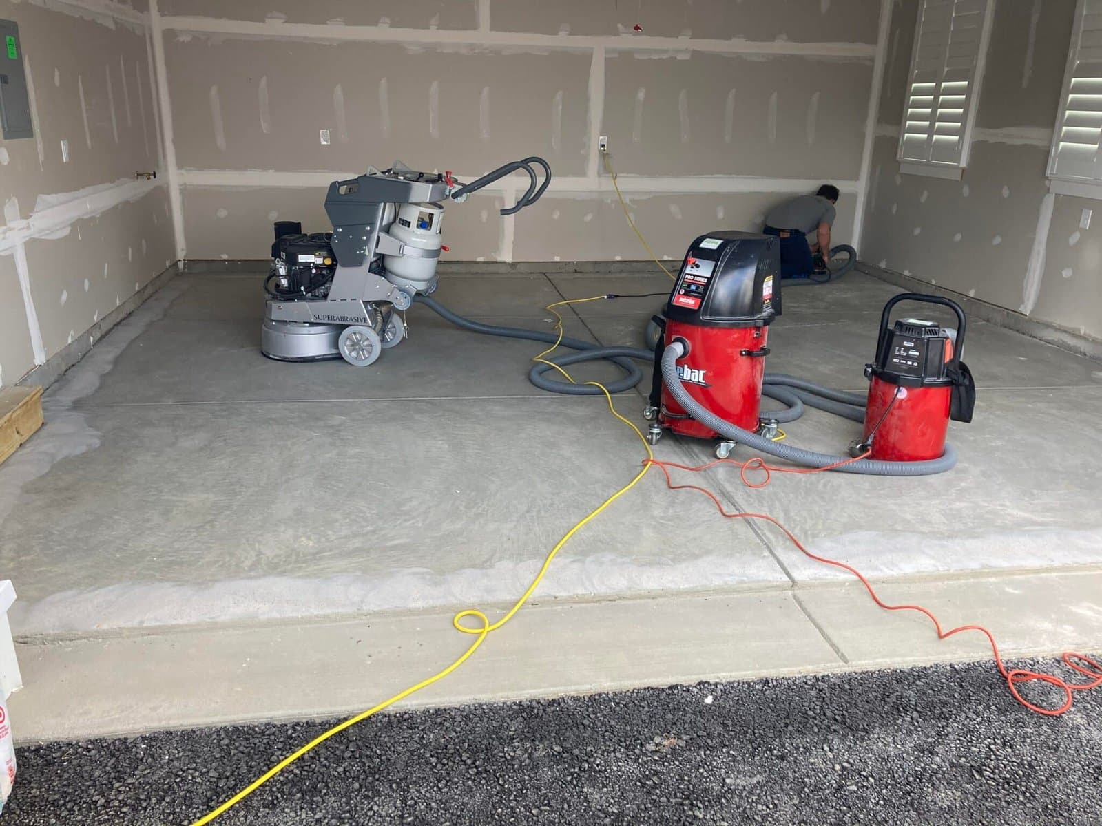 Diamond Concrete Coating crew preparing a garage floor — Cleveland, OH