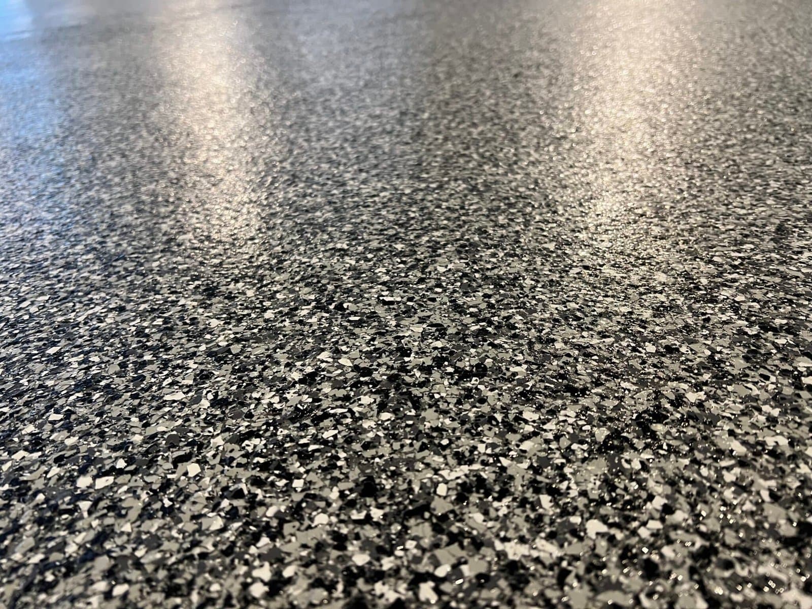 Macro closeup of glossy black and white flake coating