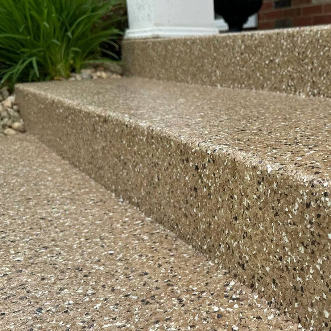 Macro close-up of flake coating wrapped over an outdoor step edge — Greater Cleveland OH