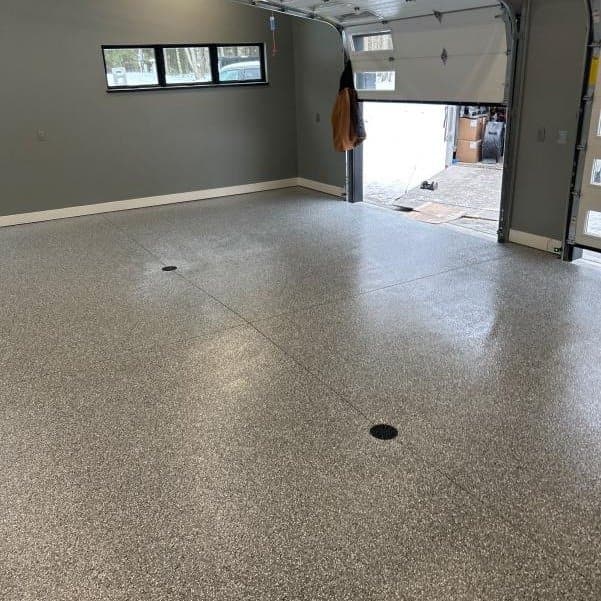 Coated garage floor in winter with snowy driveway — Cleveland, OH