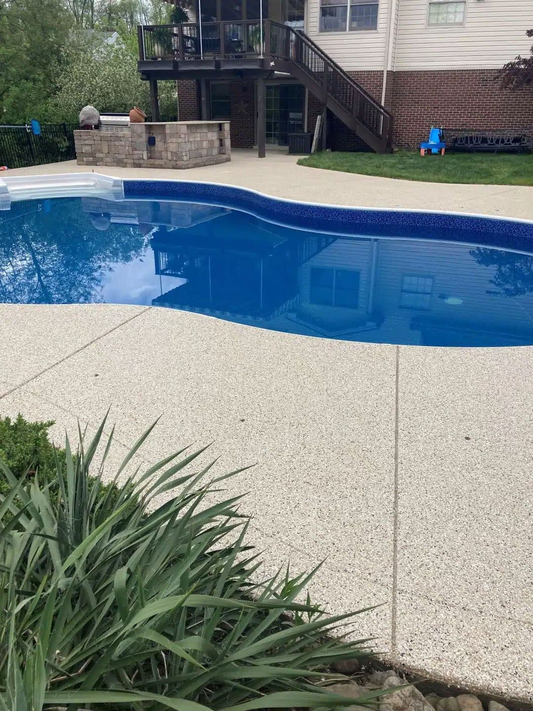 Cream flake polyurea pool deck coating — Medina County, OH