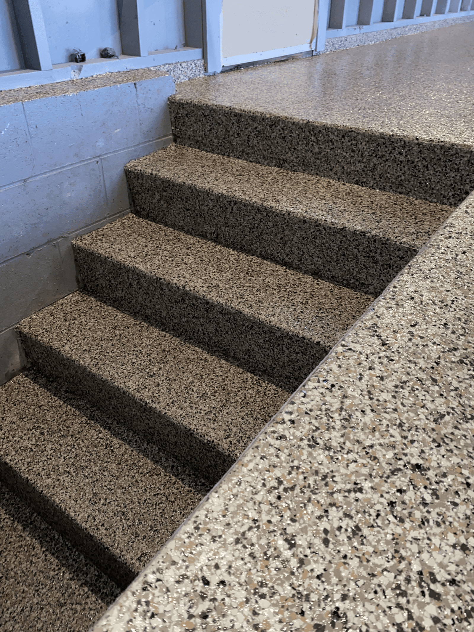 Tan-brown flake coated steps with broadcast flake detail