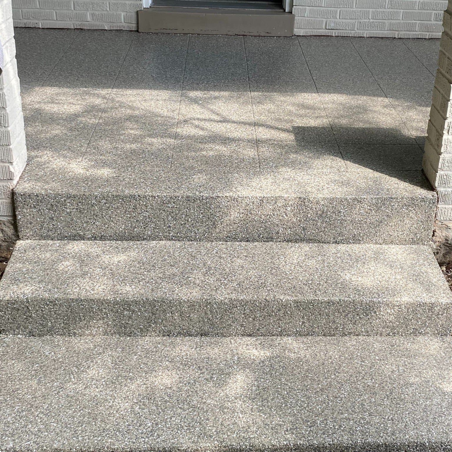 Tan flake coated front steps between brick columns — Strongsville, OH