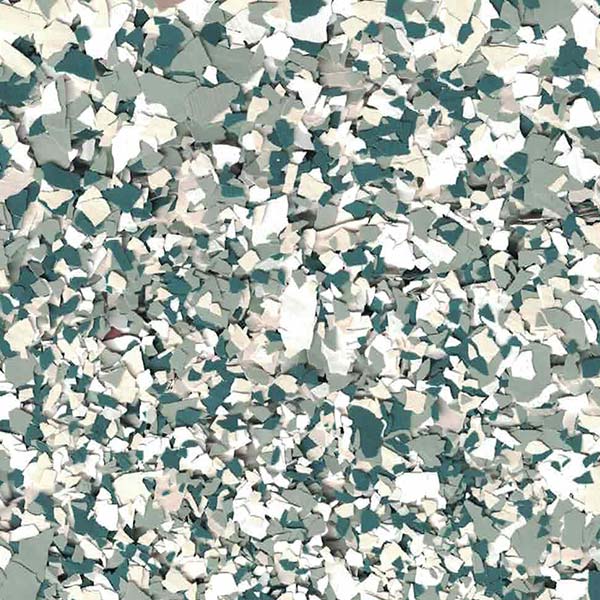 A close-up of a textured surface, featuring randomly scattered fragments in shades of white, gray, and teal, creating a chaotic, abstract pattern.
