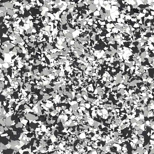 This image features a close-up of a black, white, and gray patterned surface, resembling a stone or terrazzo texture.