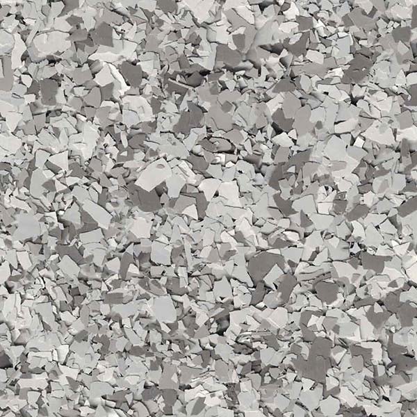 An image showing numerous small, irregularly shaped, light grey and white stone fragments closely packed together. The stones vary in size and texture.