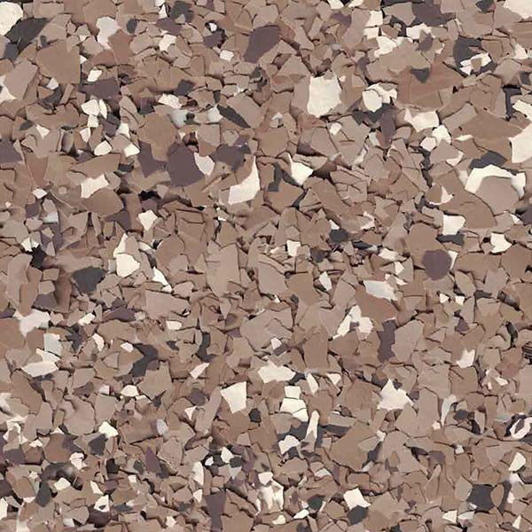 The image shows a close-up of a textured surface with irregular tan, brown, white, and gray pieces resembling a stone or abstract design.