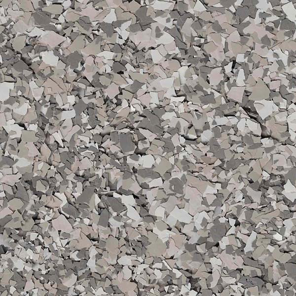 A textured surface with a random pattern of gray, beige, and white flakes, resembling a terrazzo or stone material, fills the entire image.